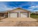 Detached two-car garage with ample parking space at 3137 W Baseline Rd, Laveen, AZ 85339