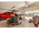 Organized garage interior with open door, a truck, storage, tools, and lots of space at 3137 W Baseline Rd, Laveen, AZ 85339