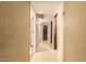 Inviting hallway with clean, bright walls and flooring, doors leading to various rooms at 3137 W Baseline Rd, Laveen, AZ 85339