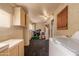 Spacious laundry area with cabinets for storage, machines, and great natural light at 3137 W Baseline Rd, Laveen, AZ 85339
