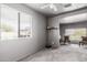 Living room featuring neutral walls, large window and comfortable sitting area at 3137 W Baseline Rd, Laveen, AZ 85339