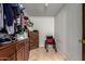 Room features cabinetry, tiled floor, wheelchair, and storage solutions for accessibility and convenience at 3137 W Baseline Rd, Laveen, AZ 85339