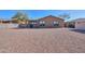 Back yard featuring low-maintenance landscaping and a view of the home at 40314 W Marion May Ln, Maricopa, AZ 85138