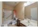Bathroom boasts a shower-tub combo and neutral walls and tiling at 40314 W Marion May Ln, Maricopa, AZ 85138