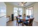 Charming dining area featuring natural light and access to the backyard at 40314 W Marion May Ln, Maricopa, AZ 85138