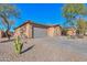 Beautiful single-story home with a xeriscaped front yard, two-car garage, and well-maintained exterior at 40314 W Marion May Ln, Maricopa, AZ 85138