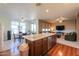 Bright kitchen featuring an island, pendant lighting, and stainless steel appliances at 40314 W Marion May Ln, Maricopa, AZ 85138