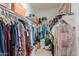 Organized walk-in closet with ample storage and hanging space at 40314 W Marion May Ln, Maricopa, AZ 85138