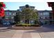 Attractive apartment building entrance with manicured landscaping in flower bed and parking lot at 435 W Rio Salado Pkwy # 210, Tempe, AZ 85281