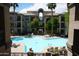 Beautiful pool area with palm trees and plenty of space to relax in the sun at 435 W Rio Salado Pkwy # 210, Tempe, AZ 85281