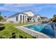 Expansive backyard with pool, lush lawn, and plenty of space for outdoor entertaining at 4457 E Fountain St, Mesa, AZ 85205