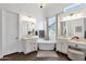 Bright and airy bathroom with dual vanities, a soaking tub, and elegant fixtures, offering a spa-like experience at 4457 E Fountain St, Mesa, AZ 85205