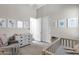 Spacious Bedroom with changing table, crib, neutral decor and artwork, creating a calming and serene environment at 4457 E Fountain St, Mesa, AZ 85205