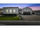 Charming single-Gathering home with a two-car garage, landscaped front yard and brick-paved driveway at 4457 E Fountain St, Mesa, AZ 85205