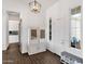 Bright foyer with tile flooring and charming decorative cabinet at 4457 E Fountain St, Mesa, AZ 85205