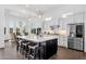 Bright, modern kitchen with stainless steel appliances, large island, and breakfast bar at 4457 E Fountain St, Mesa, AZ 85205