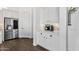Butler's pantry features white cabinetry, stainless steel refrigerator, and coffee bar area at 4457 E Fountain St, Mesa, AZ 85205
