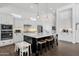Elegant kitchen with a large island, white cabinets, and stainless steel appliances at 4457 E Fountain St, Mesa, AZ 85205