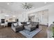 Spacious living room with wood floors and a ceiling fan, providing comfortable and stylish living space at 4457 E Fountain St, Mesa, AZ 85205