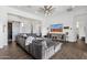 Comfortable living room with sectional sofa, TV, and wood-look flooring at 4457 E Fountain St, Mesa, AZ 85205