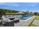 Inviting pool with patio seating, ideal for relaxing and enjoying the backyard view at 4457 E Fountain St, Mesa, AZ 85205