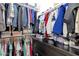 Spacious walk-in closet with double hanging rods, shelving, and ample storage space for clothes at 4457 E Fountain St, Mesa, AZ 85205