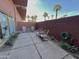 Backyard featuring chair seating, brick fence, view of palm trees and connection to unit at 4750 N Central Ave # 1N, Phoenix, AZ 85012