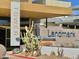 Building exterior features cacti and landscape near main building entrance, under bright sky at 4750 N Central Ave # 1N, Phoenix, AZ 85012