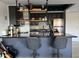 Kitchen island with bar seating, stainless steel appliances, and modern cabinets at 4750 N Central Ave # 1N, Phoenix, AZ 85012