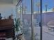 Relaxing outdoor patio with adirondack chairs, view of trees, accessed via sliding glass door at 4750 N Central Ave # 1N, Phoenix, AZ 85012
