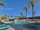 Inviting community swimming pool with palm trees and comfortable lounge chairs for relaxation at 4750 N Central Ave # 1N, Phoenix, AZ 85012