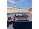 Expansive rooftop deck with comfortable seating around a modern fire pit, ideal for entertaining at 4750 N Central Ave # 1N, Phoenix, AZ 85012