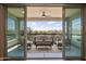 Scenic balcony with comfortable seating and a beautiful view of the desert landscape at 5100 E Rancho Paloma E Dr # 1046, Cave Creek, AZ 85331