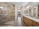 Bathroom displaying dual sinks, granite countertops, and a glass enclosed shower at 5100 E Rancho Paloma E Dr # 1046, Cave Creek, AZ 85331