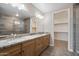 Bathroom boasts dual sinks with granite countertops and a luxurious glass shower with tile surround at 5100 E Rancho Paloma E Dr # 1046, Cave Creek, AZ 85331