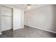 Spacious bedroom featuring wood-look tile floors, neutral walls, a ceiling fan, and closet at 5100 E Rancho Paloma E Dr # 1046, Cave Creek, AZ 85331