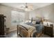Inviting bedroom with rustic decor and ample natural light creates a cozy retreat at 5100 E Rancho Paloma E Dr # 1046, Cave Creek, AZ 85331