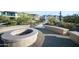Picturesque fire pit area with seating and a paved walking path at 5100 E Rancho Paloma E Dr # 1046, Cave Creek, AZ 85331