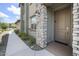Close-up of the front door showcasing stone accents and the house number clearly displayed at 5100 E Rancho Paloma E Dr # 1046, Cave Creek, AZ 85331