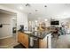 Open-concept kitchen with granite counters and stainless steel appliances flows into dining area at 5100 E Rancho Paloma E Dr # 1046, Cave Creek, AZ 85331