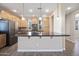 Bright kitchen features wood cabinets, granite countertops, stainless steel appliances, and a large island at 5100 E Rancho Paloma E Dr # 1046, Cave Creek, AZ 85331