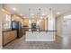 Bright kitchen features wood cabinets, granite countertops, stainless steel appliances, and a large island at 5100 E Rancho Paloma E Dr # 1046, Cave Creek, AZ 85331