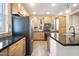 Bright kitchen features wood cabinets, granite countertops, stainless steel appliances, and an eat-in island at 5100 E Rancho Paloma E Dr # 1046, Cave Creek, AZ 85331