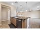 Bright kitchen features wood cabinets, granite countertops, stainless steel appliances, and breakfast bar at 5100 E Rancho Paloma E Dr # 1046, Cave Creek, AZ 85331