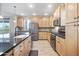 Bright kitchen features wood cabinets, granite countertops, stainless steel appliances, and eat-in island at 5100 E Rancho Paloma E Dr # 1046, Cave Creek, AZ 85331