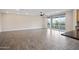 Bright living room features sliding doors to balcony, wood-look flooring and ceiling fan at 5100 E Rancho Paloma E Dr # 1046, Cave Creek, AZ 85331