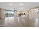 Open concept living room with balcony access, wood look flooring, and modern lighting at 5100 E Rancho Paloma E Dr # 1046, Cave Creek, AZ 85331