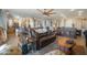 Spacious living room featuring a comfortable brown leather couch, wood accents, and modern lighting fixtures at 5100 E Rancho Paloma E Dr # 1046, Cave Creek, AZ 85331