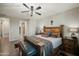 Spacious main bedroom features rustic furnishings, ceiling fan, and plenty of natural light at 5100 E Rancho Paloma E Dr # 1046, Cave Creek, AZ 85331