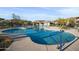 Sparkling community pool with lounge chairs and desert plants at 5100 E Rancho Paloma E Dr # 1046, Cave Creek, AZ 85331